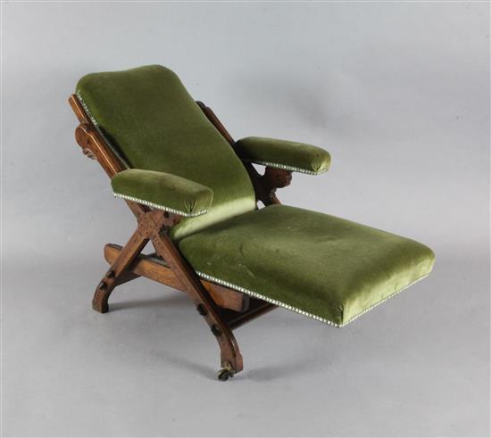 A Victorian Reformed Gothic walnut and marquetry Reclining Chair, designed by Charles Bevan, c.1865, under licence to Marsh, Jones &